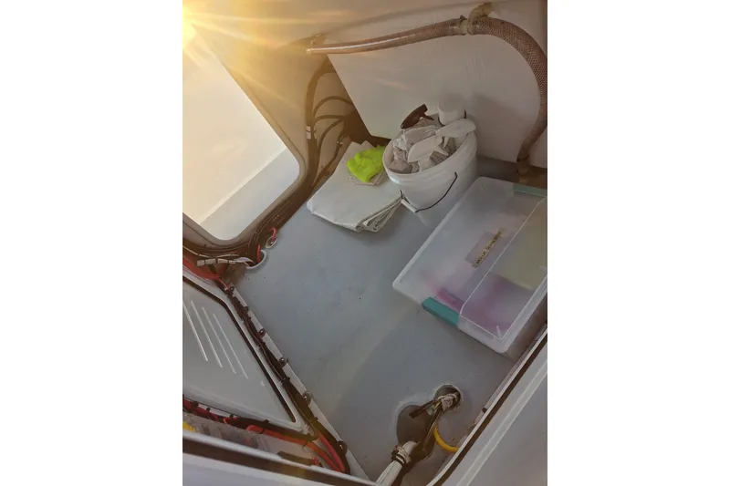 Slide: The Image of 2022 Tidal Creeks Boatworks Center Console interior with storage and sunlight. - 32