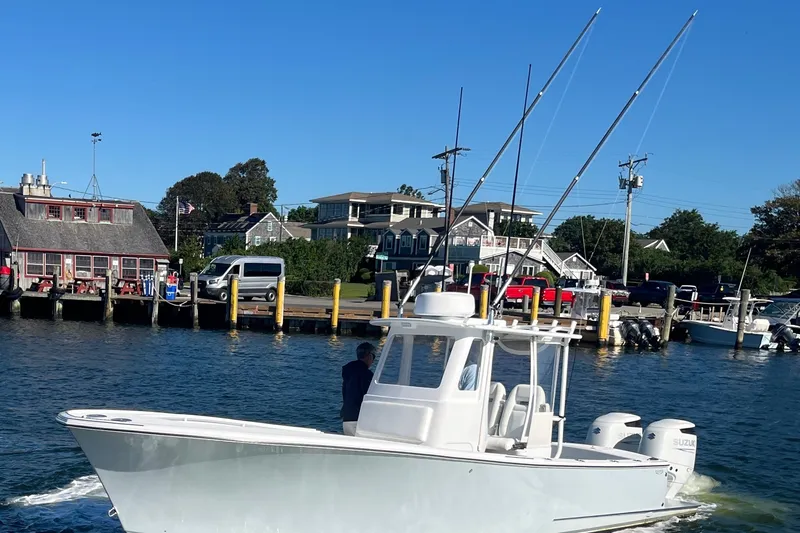Slide: The Image of 2022 Tidal Creeks Boatworks Center Console cruising near a dock on a sunny day. - 20