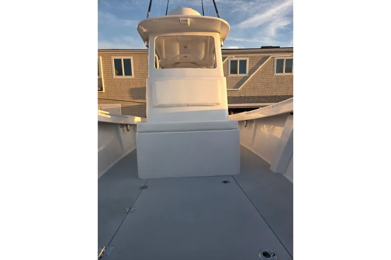 Slide: The Image of 2022 Tidal Creeks Boatworks Center Console, white deck, sunny day, residential background. - 47
