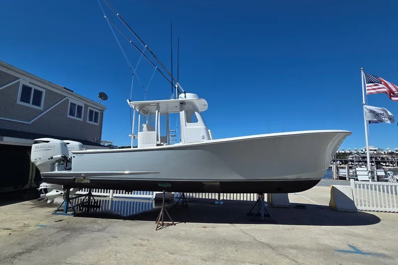 Slide: The Image of 2022 Tidal Creeks Boatworks Center Console on display at a marina with clear blue sky. - 24
