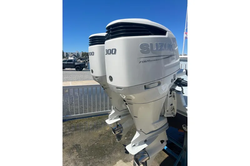 Slide: The Image of Twin Suzuki 300 outboard engines on a 2022 Tidal Creeks Boatworks Center Console. - 21
