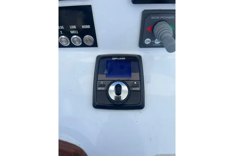 Slide: The Image of Control panel of a 2022 Tidal Creeks Boatworks Center Console with navigation and thruster controls. - 15