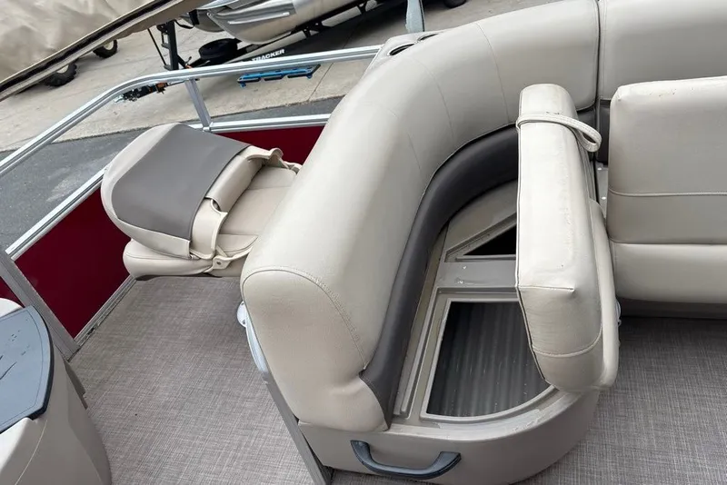 Slide: The Image of 2024 Sun Tracker Bass Buggy 18 DLX interior seating with storage compartments. - 27