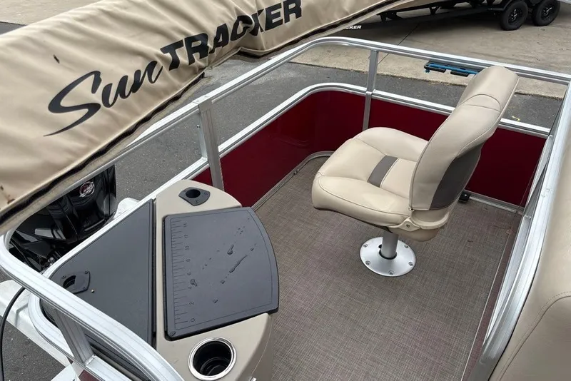 Slide: The Image of 2024 Sun Tracker Bass Buggy 18 DLX interior with seating and fishing station. - 26