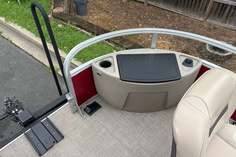 Slide: The Image of 2024 Sun Tracker Bass Buggy 18 DLX boat interior with seating and control panel. - 22