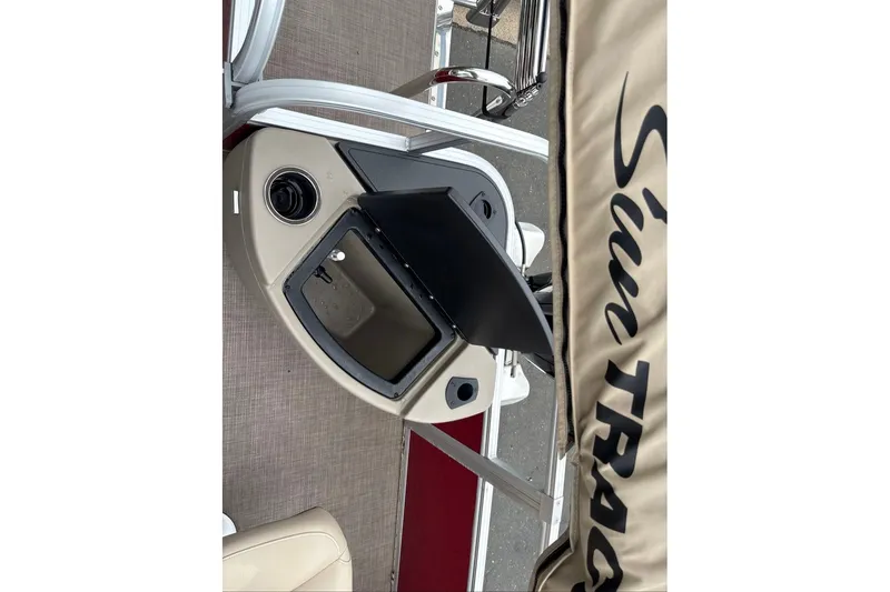 Slide: The Image of 2024 Sun Tracker Bass Buggy 18 DLX boat interior with storage compartment open. - 25
