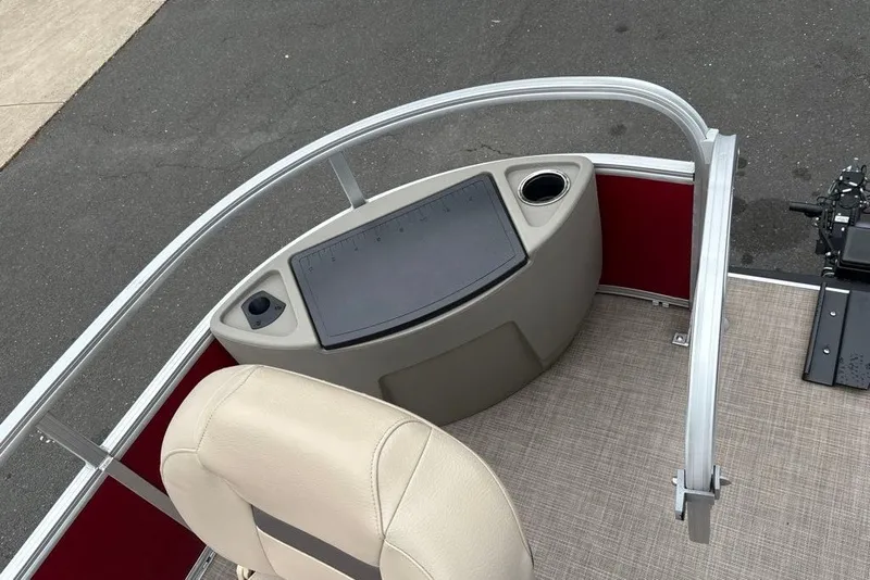 Slide: The Image of 2024 Sun Tracker Bass Buggy 18 DLX boat interior with seating and control panel. - 24