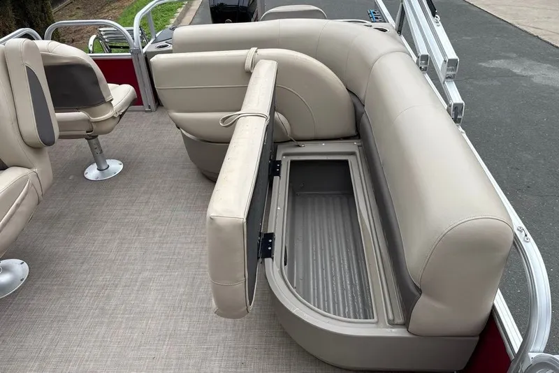 Slide: The Image of 2024 Sun Tracker Bass Buggy 18 DLX pontoon boat with open storage compartment. - 28