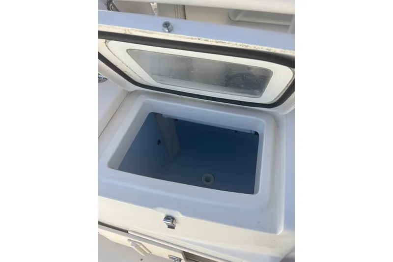 Slide: The Image of Open storage compartment on 2021 Grady-White Canyon 306 boat. - 22