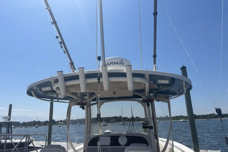 Slide: The Image of 2021 Grady-White Canyon 306 boat with Garmin equipment, docked on a sunny day. - 6