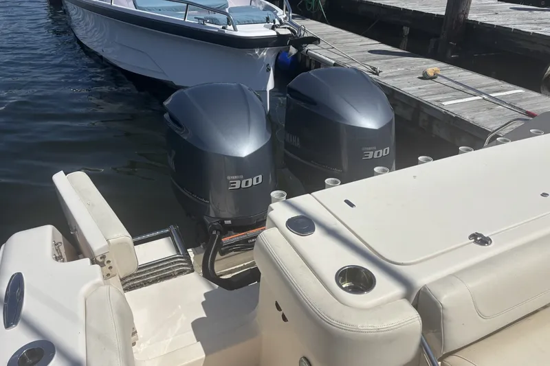 Slide: The Image of 2021 Grady-White Canyon 306 with twin Yamaha 300 engines docked at marina. - 13