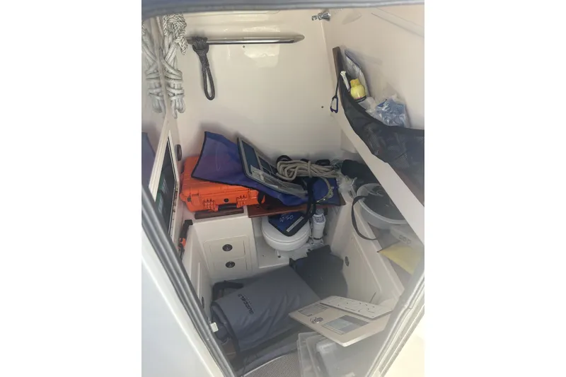 Slide: The Image of Interior storage of 2021 Grady-White Canyon 306 boat with equipment and supplies. - 21