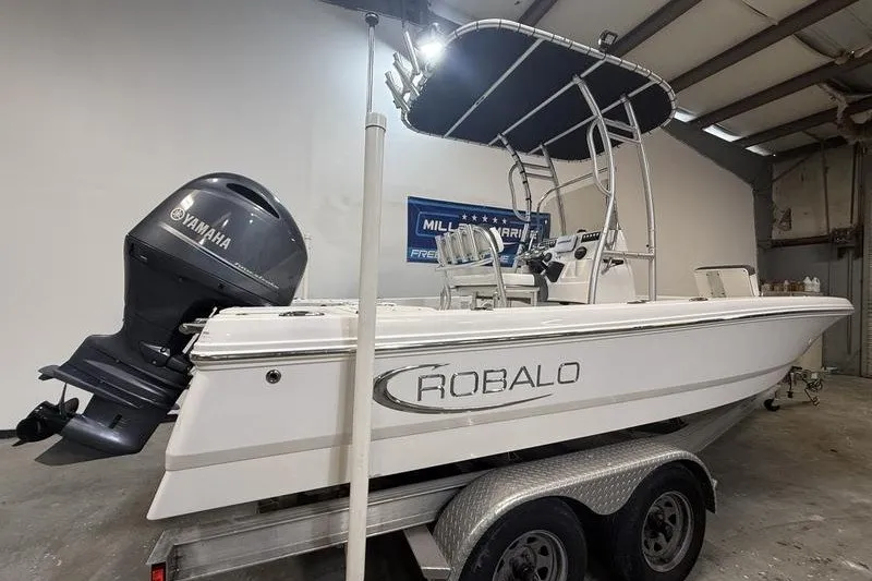 Slide: The Image of 2020 Robalo 206 Cayman boat with Yamaha engine in indoor storage. - 3