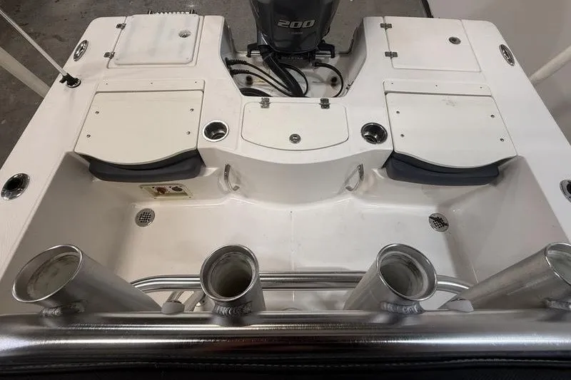 Slide: The Image of 2020 Robalo 206 Cayman boat deck with rod holders and engine view. - 7