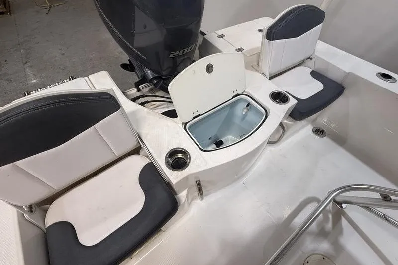 Slide: The Image of 2020 Robalo 206 Cayman boat interior with seating and storage compartments. - 5