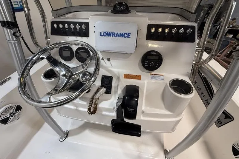 Slide: The Image of 2020 Robalo 206 Cayman boat dashboard with steering wheel and Lowrance GPS system. - 10