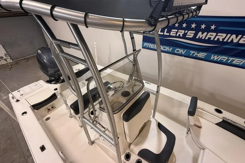 Slide: The Image of 2020 Robalo 206 Cayman boat interior with T-top and steering console. - 12