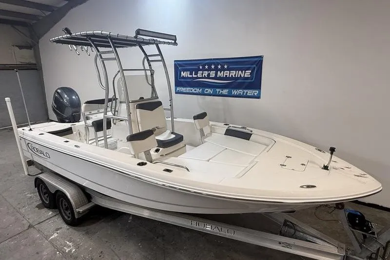 Slide: The Image of 2020 Robalo 206 Cayman boat on trailer at Miller's Marine showroom. - 2