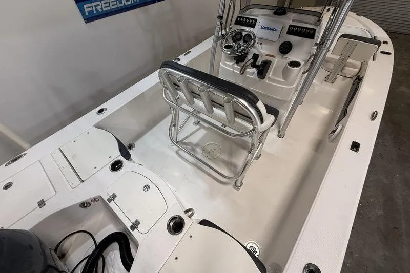 Slide: The Image of 2020 Robalo 206 Cayman boat interior with steering console and seating. - 8