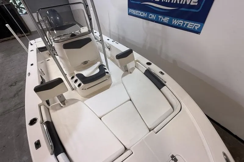 Slide: The Image of 2020 Robalo 206 Cayman boat interior with seating and console, showcasing sleek design. - 15