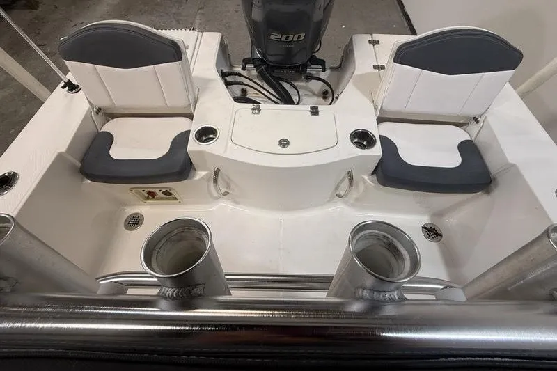 Slide: The Image of 2020 Robalo 206 Cayman boat interior with seating and engine view. - 6