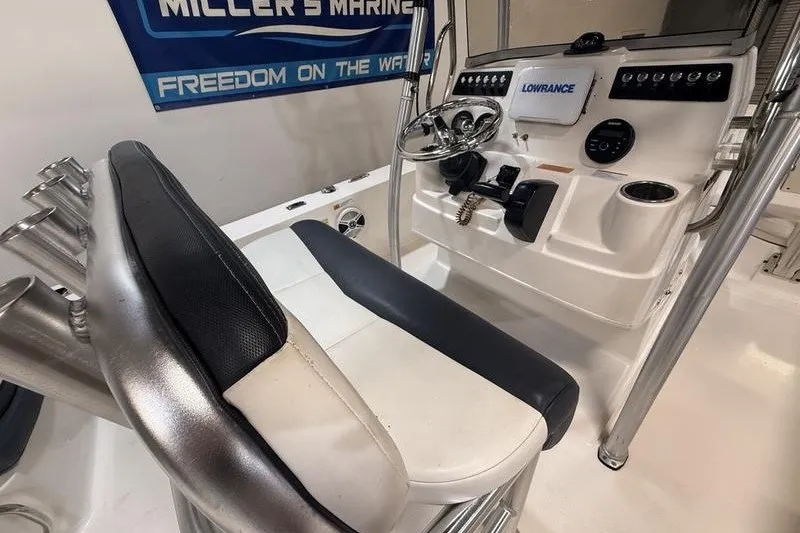 Slide: The Image of 2020 Robalo 206 Cayman boat console with steering wheel and navigation equipment. - 11