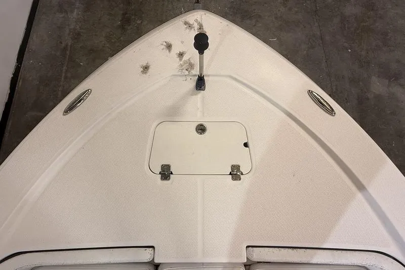 Slide: The Image of 2020 Robalo 206 Cayman boat deck with storage hatch and handle. - 16
