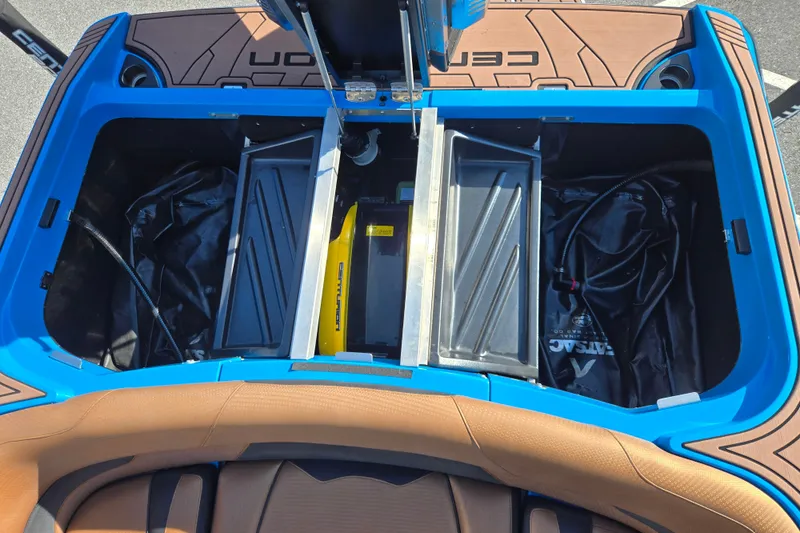 Slide: The Image of 2021 Centurion Ri257 boat storage compartments with ballast bags and equipment. - 22