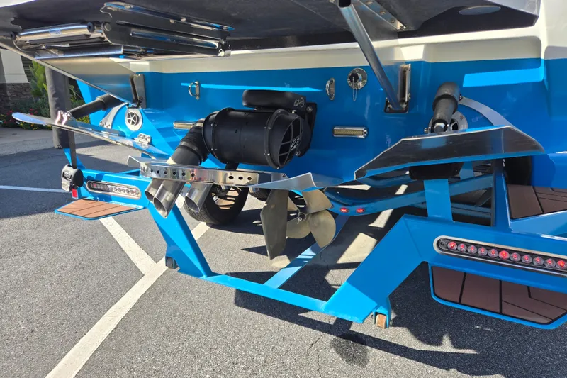 Slide: The Image of Rear view of a 2021 Centurion Ri257 boat showing propeller and exhaust system. - 29