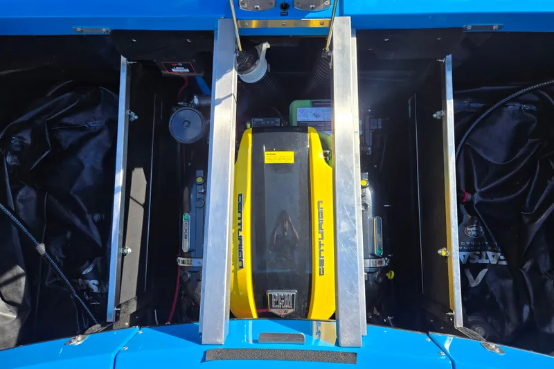 Slide: The Image of Engine compartment of a 2021 Centurion Ri257 boat, showcasing mechanical components. - 23