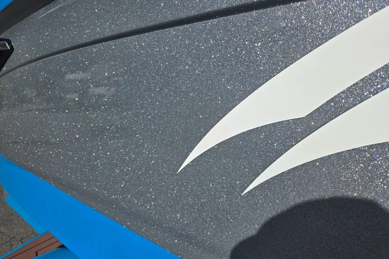 Slide: The Image of 2021 Centurion Ri257 boat with glittery gray and blue exterior detailing. - 33