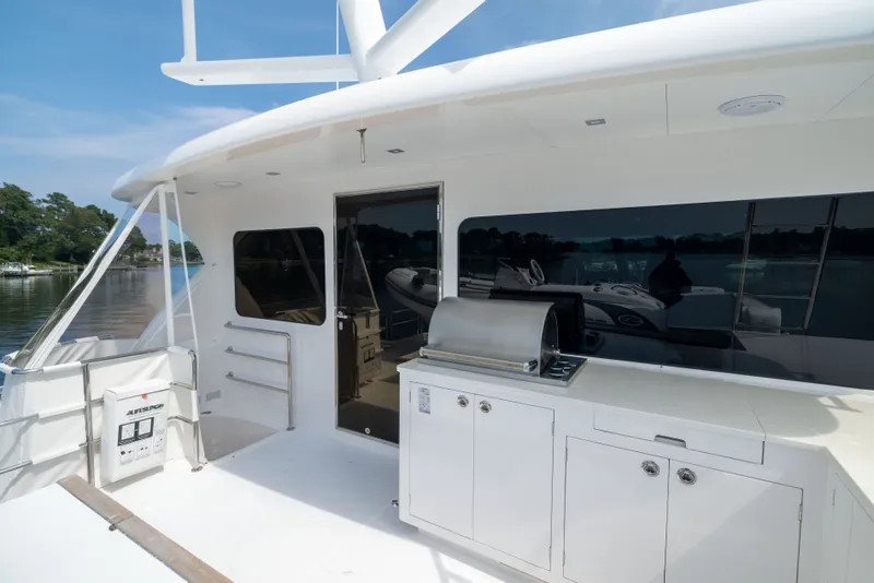 Slide: The Image of Luxury yacht Horizon PC65 2019 with outdoor kitchen and grill on deck. - 11