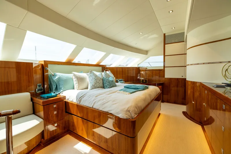 Slide: The Image of Luxurious 2019 Horizon PC65 yacht bedroom with elegant wood finishes and large windows. - 35