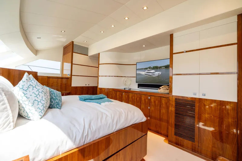 Slide: The Image of Luxurious 2019 Horizon PC65 yacht bedroom with elegant wood finishes and modern decor. - 36