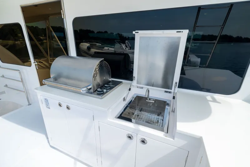 Slide: The Image of Outdoor kitchen on 2019 Horizon PC65 yacht with grill and sink. - 12