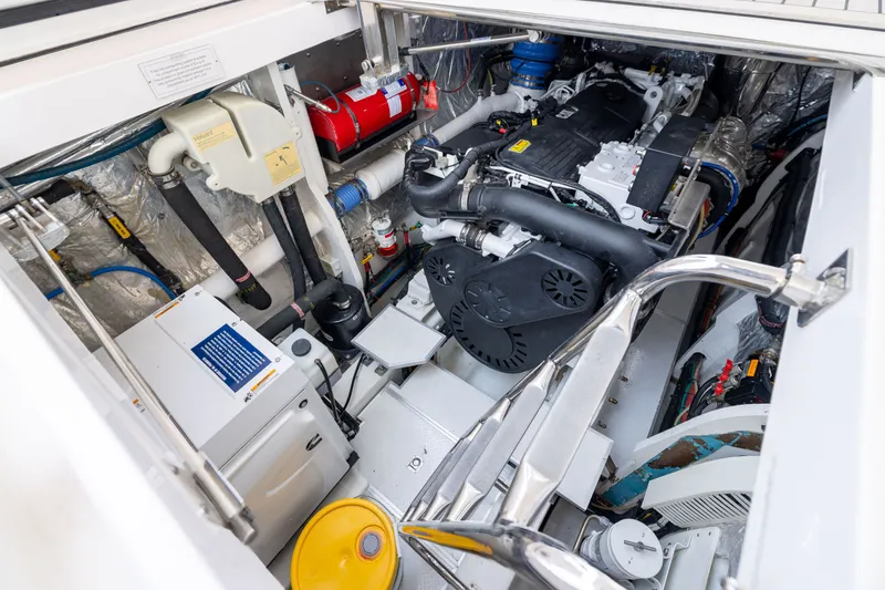 Slide: The Image of Engine room of 2019 Horizon PC65 yacht, showcasing machinery and equipment. - 55