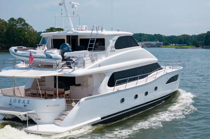 Slide: The Image of Luxurious 2019 Horizon PC65 yacht cruising on a serene lake. - 5