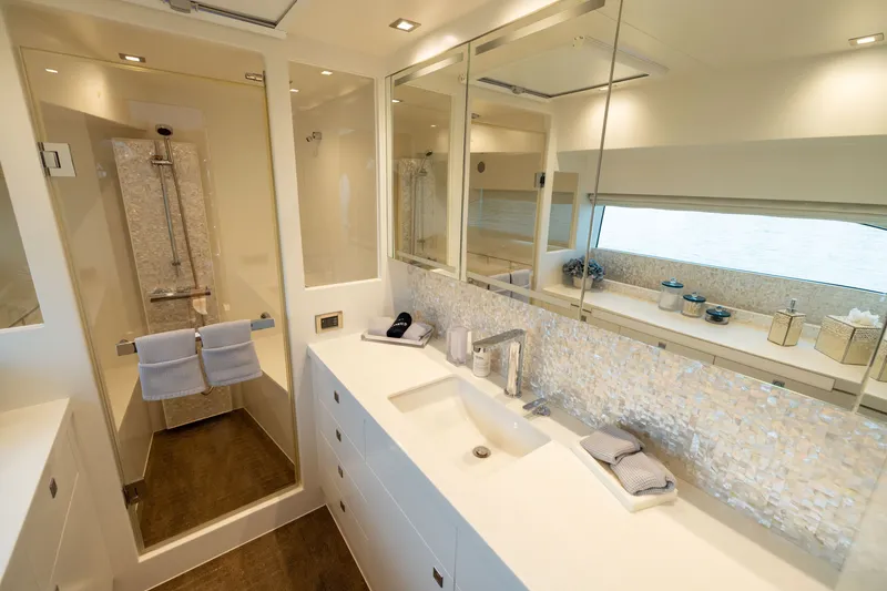 Slide: The Image of Luxurious bathroom in 2019 Horizon PC65 yacht with modern fixtures and elegant design. - 40