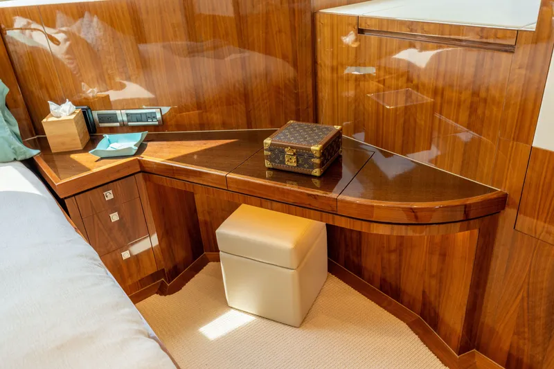 Slide: The Image of Luxurious wooden interior of 2019 Horizon PC65 yacht with elegant decor and storage. - 38