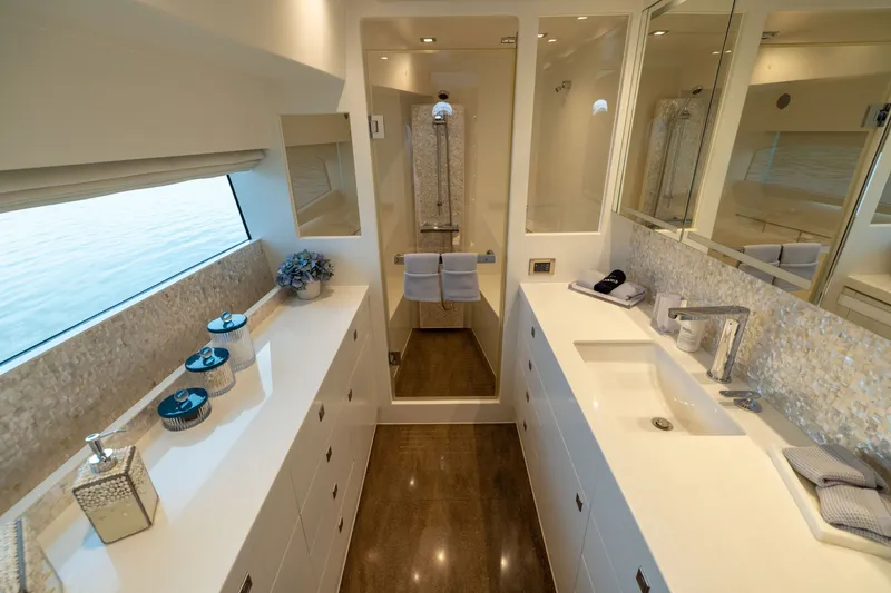 Slide: The Image of Luxurious bathroom interior on 2019 Horizon PC65 yacht, featuring elegant fixtures and ocean view. - 39