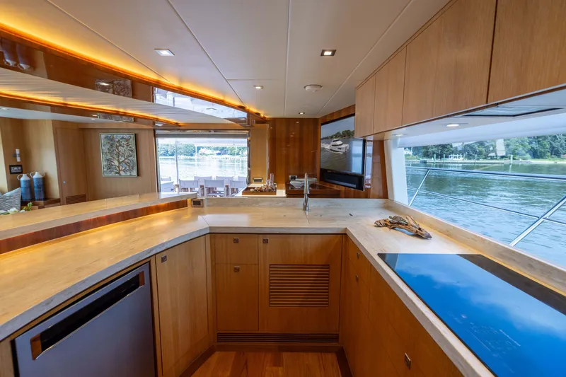 Slide: The Image of Luxurious kitchen interior on 2019 Horizon PC65 yacht with scenic water view. - 27