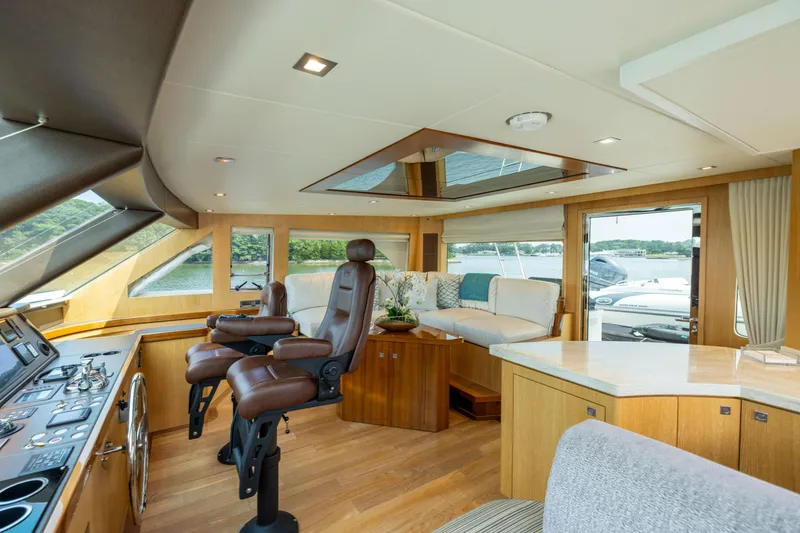Slide: The Image of Luxurious interior of 2019 Horizon PC65 yacht with leather seating and panoramic windows. - 14