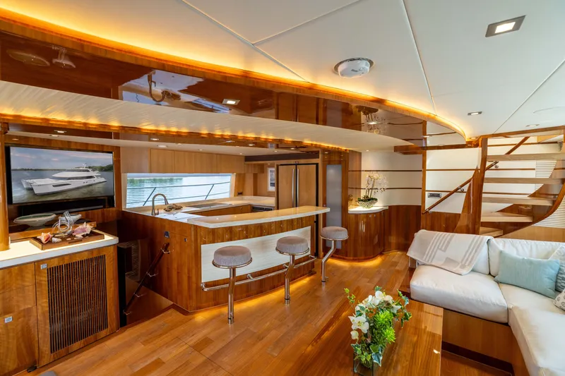 Slide: The Image of Luxurious interior of 2019 Horizon PC65 yacht with elegant wood finishes and modern amenities. - 25