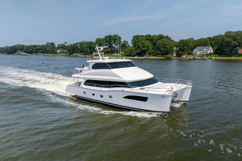 The Image of Luxury Horizon PC65 yacht cruising on a scenic river, 2019 model. - 0