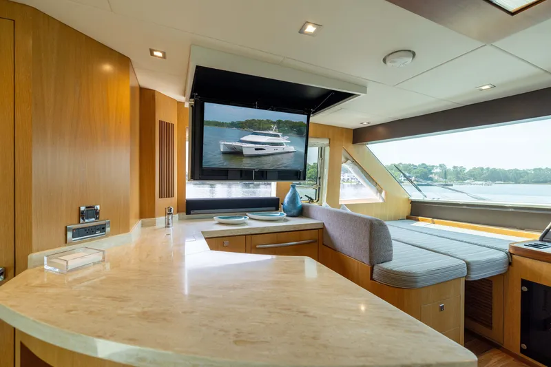 Slide: The Image of Luxurious interior of 2019 Horizon PC65 yacht with modern design and scenic window view. - 16