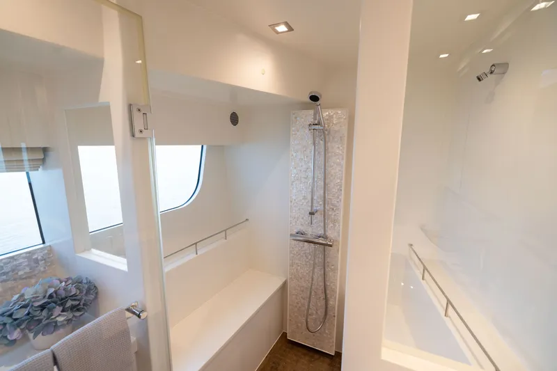 Slide: The Image of Luxurious bathroom interior on 2019 Horizon PC65 yacht with modern shower design. - 41