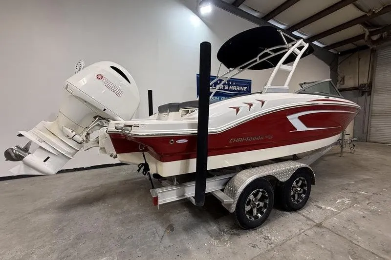Slide: The Image of 2019 Chaparral 23 H2O Sport boat on trailer in indoor storage. - 3
