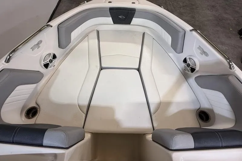 Slide: The Image of 2019 Chaparral 23 H2O Sport boat interior with gray and white seating. - 17
