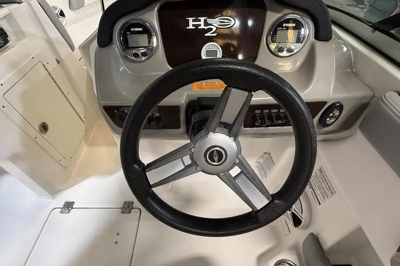 Slide: The Image of Steering wheel and dashboard of 2019 Chaparral 23 H2O Sport boat. - 11
