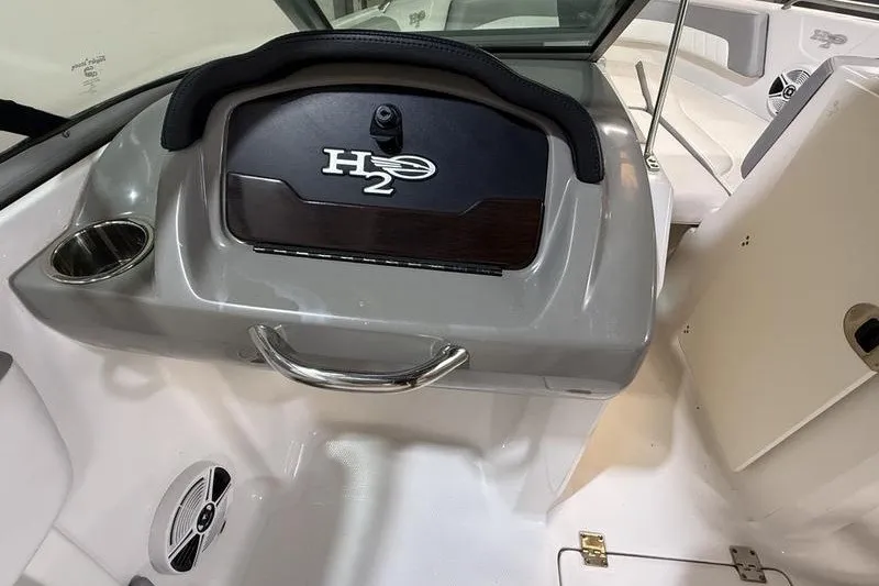 Slide: The Image of 2019 Chaparral 23 H2O Sport boat interior with H2 branding and sleek design. - 10